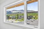 Experience breathtaking mountain views from this stunning modern home.