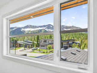 Experience breathtaking mountain views from this stunning modern home.