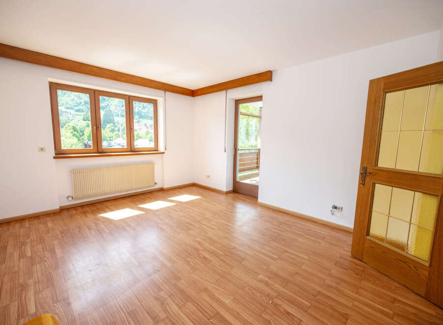 Discover this bright and airy room featuring a large multi-pane window that floods the space with natural light.
