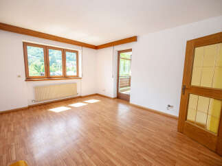 Discover this bright and airy room featuring a large multi-pane window that floods the space with natural light.