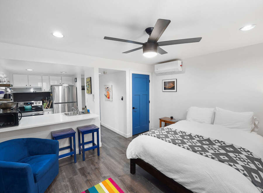 Discover this charming studio apartment featuring a modern kitchen with stainless steel appliances and ample cabinet space.