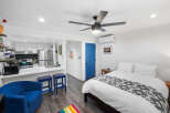 Discover this charming studio apartment featuring a modern kitchen with stainless steel appliances and ample cabinet space.