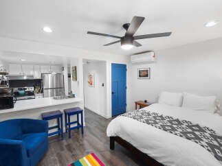 Discover this charming studio apartment featuring a modern kitchen with stainless steel appliances and ample cabinet space.