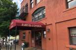 Discover comfortable living at Jarvis Condos, featuring a welcoming entrance with a prominent awning and double doors.