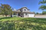 Discover this charming two-story home featuring a welcoming front porch and a spacious two-car garage.