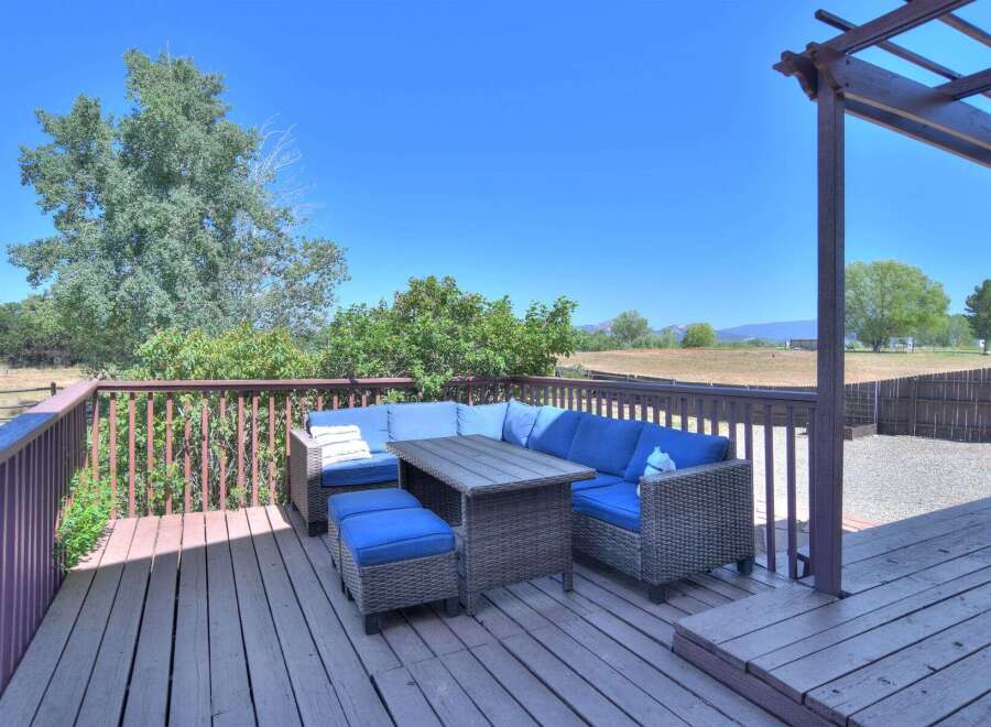 Enjoy outdoor living on this spacious deck, perfect for entertaining or relaxing with a view.