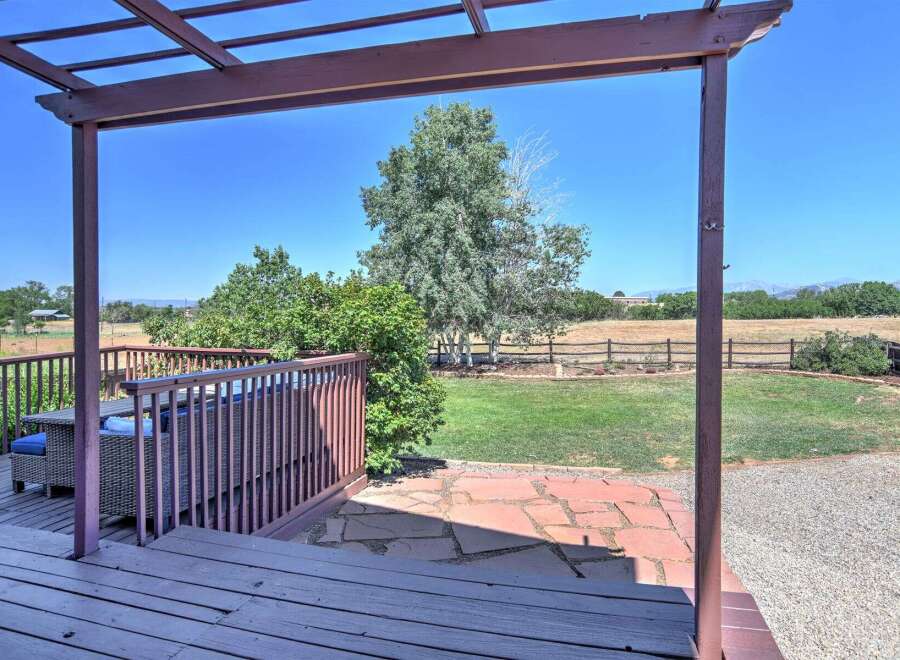 Enjoy outdoor living with this spacious deck and patio area, perfect for entertaining or relaxing.