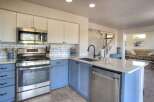 Experience the heart of this home with a beautifully updated kitchen featuring crisp white subway tile backsplash and two-toned cabinetry.