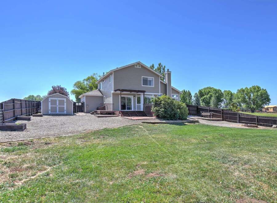 Discover this spacious backyard, perfect for outdoor living and entertaining.