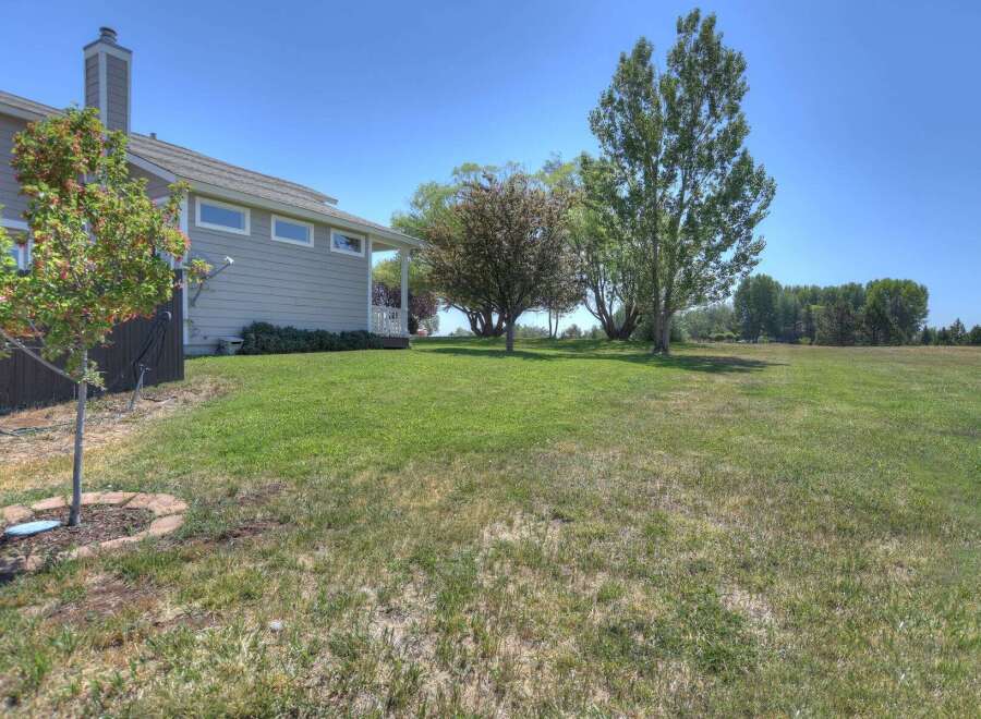 Enjoy the spacious backyard of this beautiful home, perfect for outdoor activities and relaxation.