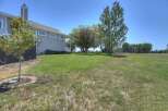 Enjoy the spacious backyard of this beautiful home, perfect for outdoor activities and relaxation.
