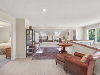 Discover this versatile loft space, perfect for a home office or additional living area.