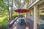 Enjoy outdoor living on this spacious deck, perfect for entertaining or relaxing amidst nature.