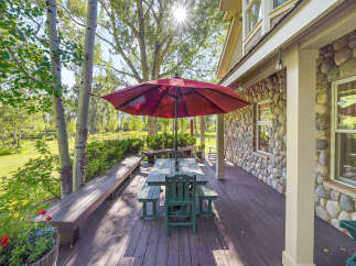 Enjoy outdoor living on this spacious deck, perfect for entertaining or relaxing amidst nature.