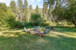 Enjoy the serene outdoors with this charming fire pit area, perfect for gathering with loved ones.