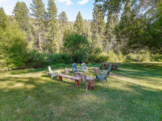 Enjoy the serene outdoors with this charming fire pit area, perfect for gathering with loved ones.