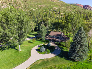 Nestled amidst a lush forest and rolling hills, this stunning property offers a serene retreat.