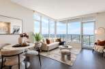 Experience modern living in this stunning apartment featuring a spacious living and dining area with breathtaking panoramic city views.