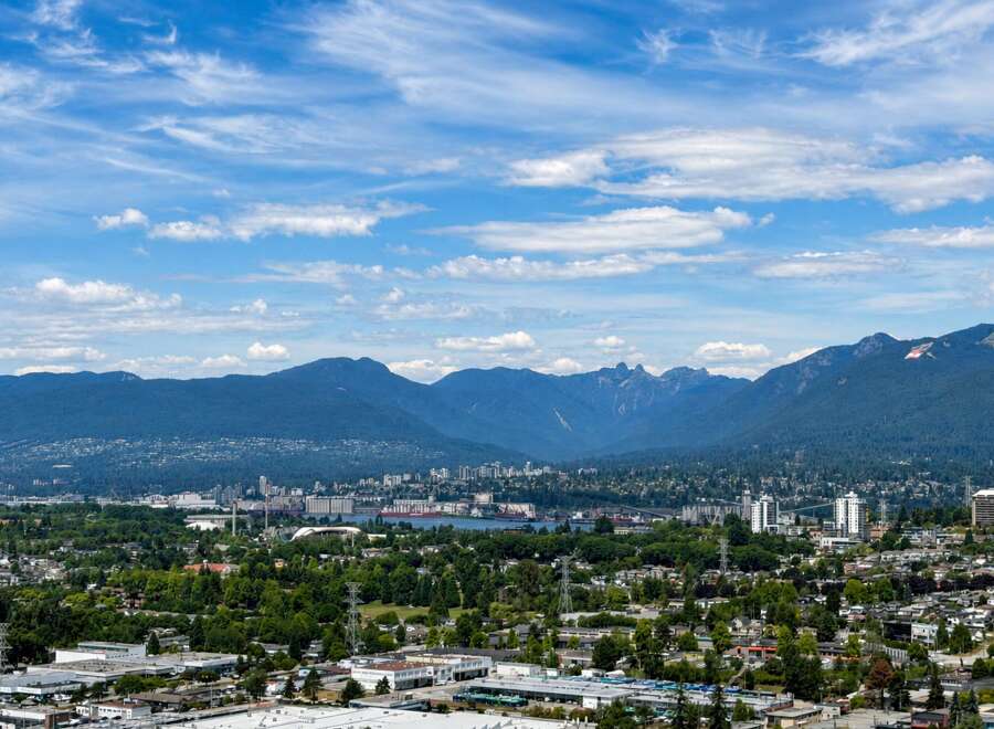 Experience breathtaking panoramic views of the city skyline and majestic mountains from this stunning property.