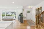 Step into this bright and airy living space, featuring a large bay window that floods the room with natural light.