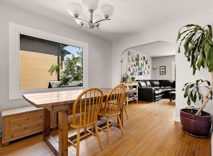 This inviting dining area features a rustic wooden table and chairs, perfect for family meals.