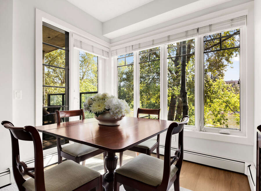 Enjoy breathtaking natural views from this charming dining area, featuring a large bay window that floods the space with sunlight.