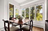 Enjoy breathtaking natural views from this charming dining area, featuring a large bay window that floods the space with sunlight.