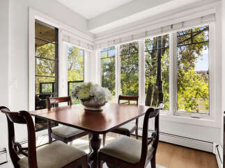 Enjoy breathtaking natural views from this charming dining area, featuring a large bay window that floods the space with sunlight.
