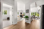 Step into this beautifully appointed living space, featuring a cozy fireplace and ample natural light.