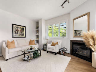 Experience comfort and style in this inviting living room, featuring a plush sofa and a cozy armchair perfect for relaxation.