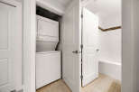 Discover convenience with this stacked washer and dryer unit, perfect for maximizing space in your home.