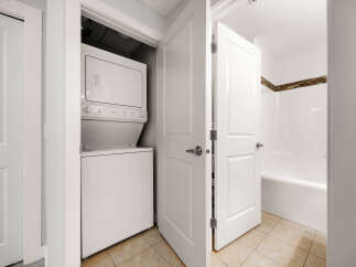 Discover convenience with this stacked washer and dryer unit, perfect for maximizing space in your home.