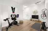 Transform your home into a personal fitness sanctuary with this dedicated workout space.
