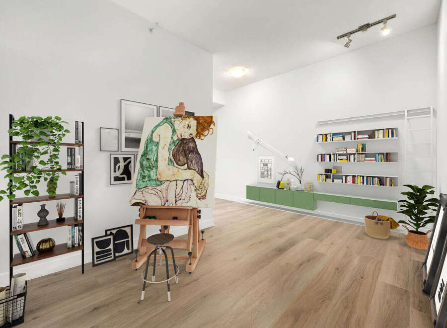 This spacious living area is perfect for artists and book lovers, featuring a large easel with a captivating painting and ample shelving for your literary collection.