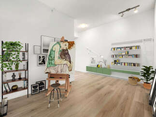 This spacious living area is perfect for artists and book lovers, featuring a large easel with a captivating painting and ample shelving for your literary collection.