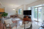 Experience modern living in this bright and airy condo, featuring a spacious open-concept living and dining area perfect for entertaining.