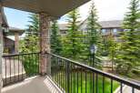 Enjoy your morning coffee on this private balcony overlooking lush greenery and mature trees.