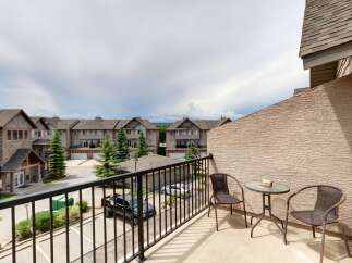 Enjoy your morning coffee or evening relaxation on this private balcony overlooking a charming neighborhood.
