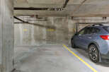 Discover convenient underground parking at this property, featuring assigned spots marked with clear numbering.