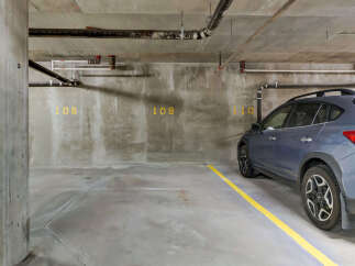 Discover convenient underground parking at this property, featuring assigned spots marked with clear numbering.