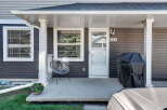 Welcome to this charming home featuring a covered front porch, perfect for enjoying your morning coffee.