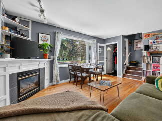 Step into this inviting living and dining area, perfect for both relaxation and entertaining.