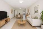 Experience modern living in this beautifully staged open-concept living and dining area.