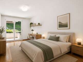 Discover this serene bedroom featuring a comfortable bed with plush linens and a calming green accent throw.