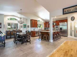 Experience spacious living in this open-concept kitchen and dining area, perfect for entertaining.