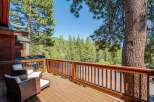 Enjoy the serene mountain views from this charming wooden deck, perfect for relaxing or entertaining.