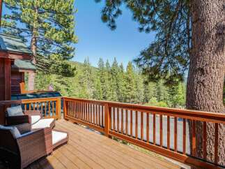 Enjoy the serene mountain views from this charming wooden deck, perfect for relaxing or entertaining.