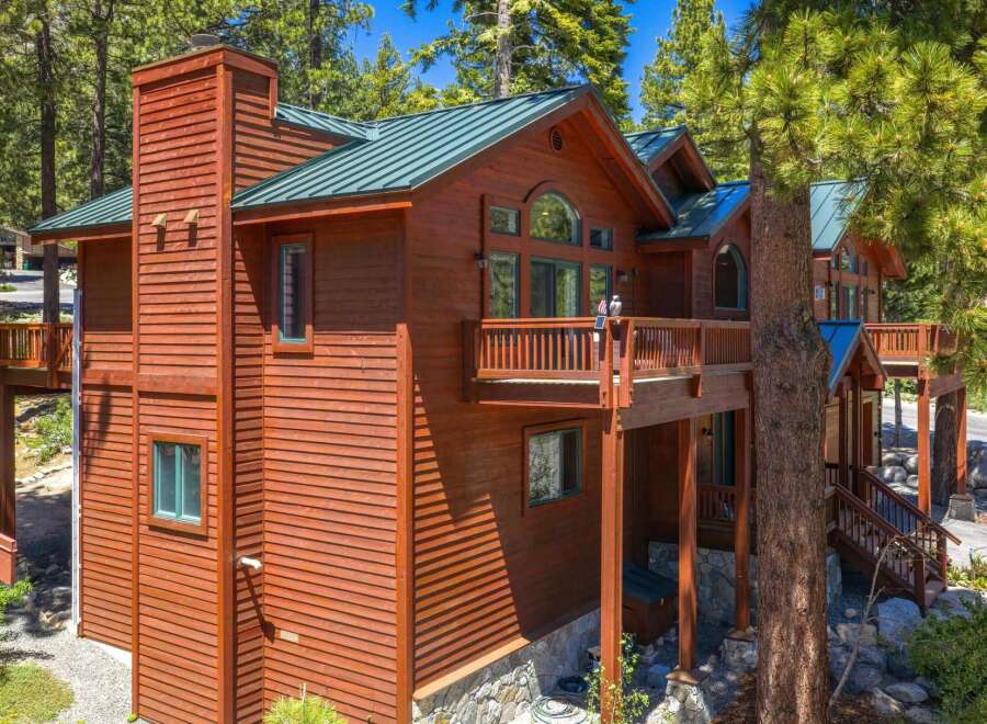 Experience mountain living in this stunning wooden lodge, nestled amongst tall pine trees.