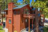 Experience mountain living in this stunning wooden lodge, nestled amongst tall pine trees.