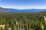 Experience breathtaking panoramic views of Lake Tahoe and the surrounding snow-capped mountains from this stunning property.